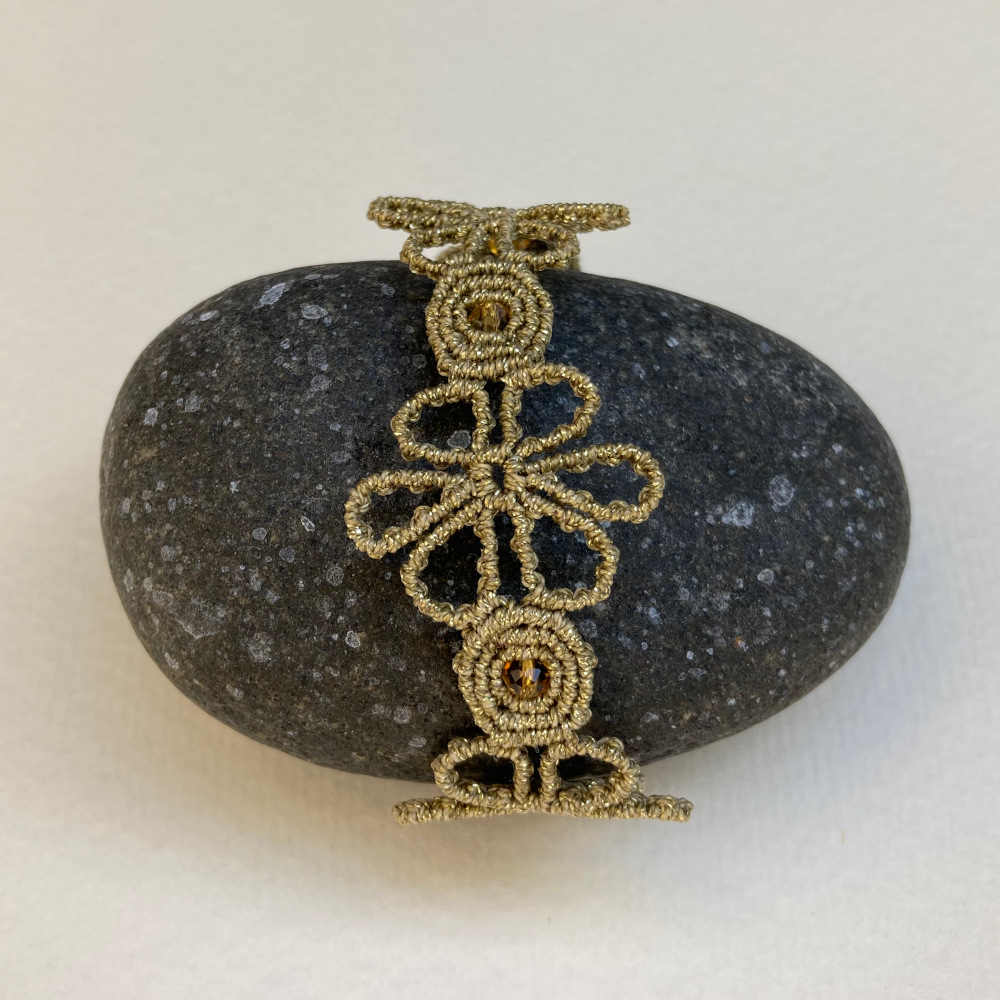 handmade macrame bracelet in golden tone