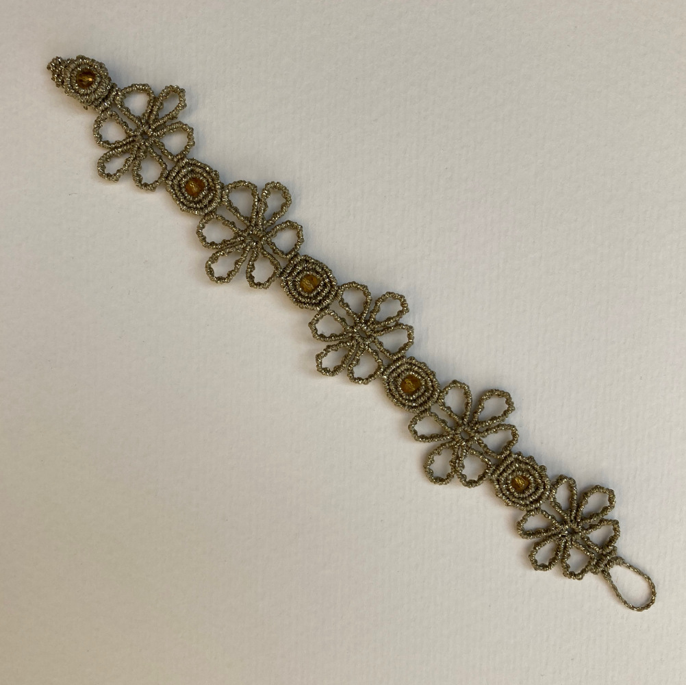 handmade macrame bracelet in golden color