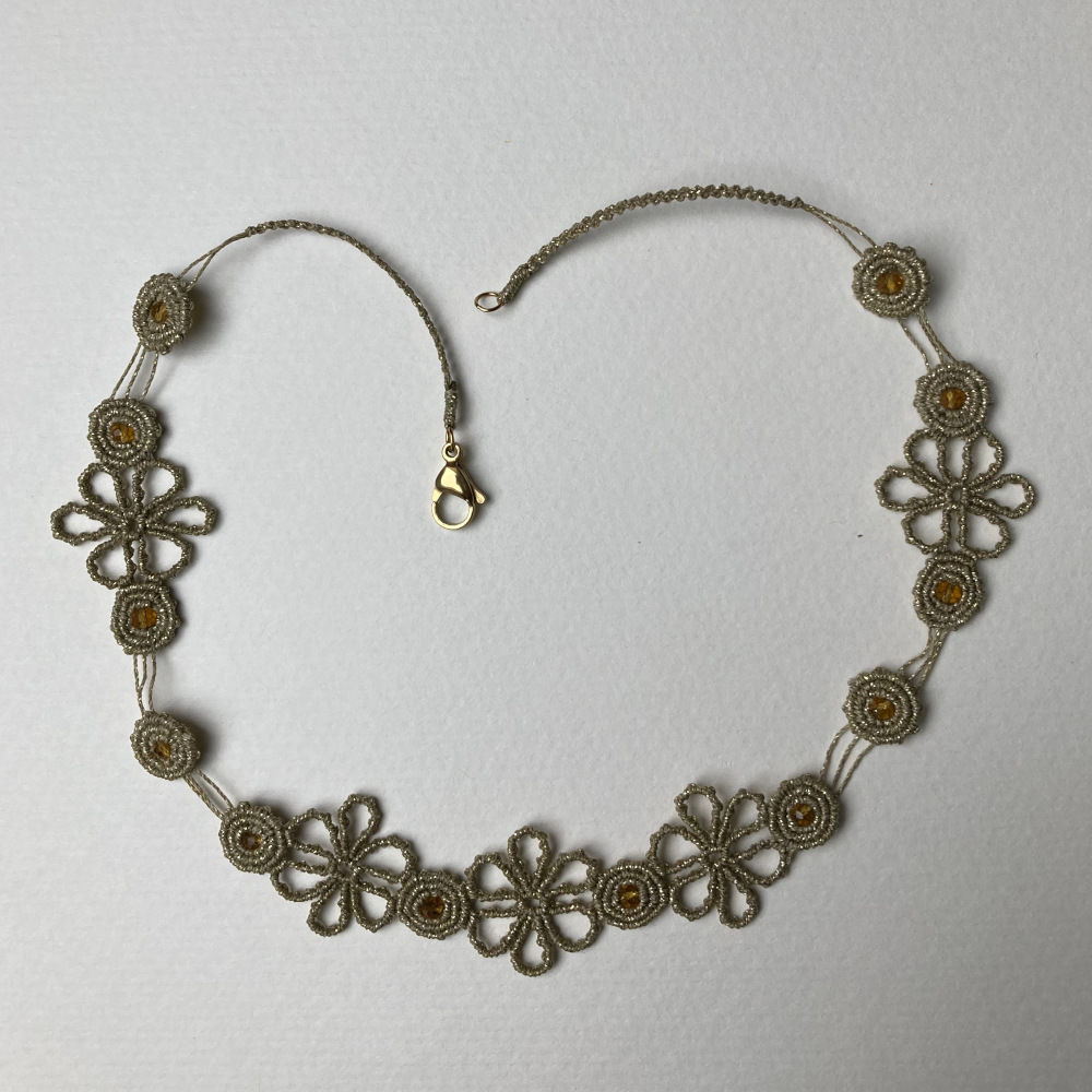 handmade macrame necklace in golden color